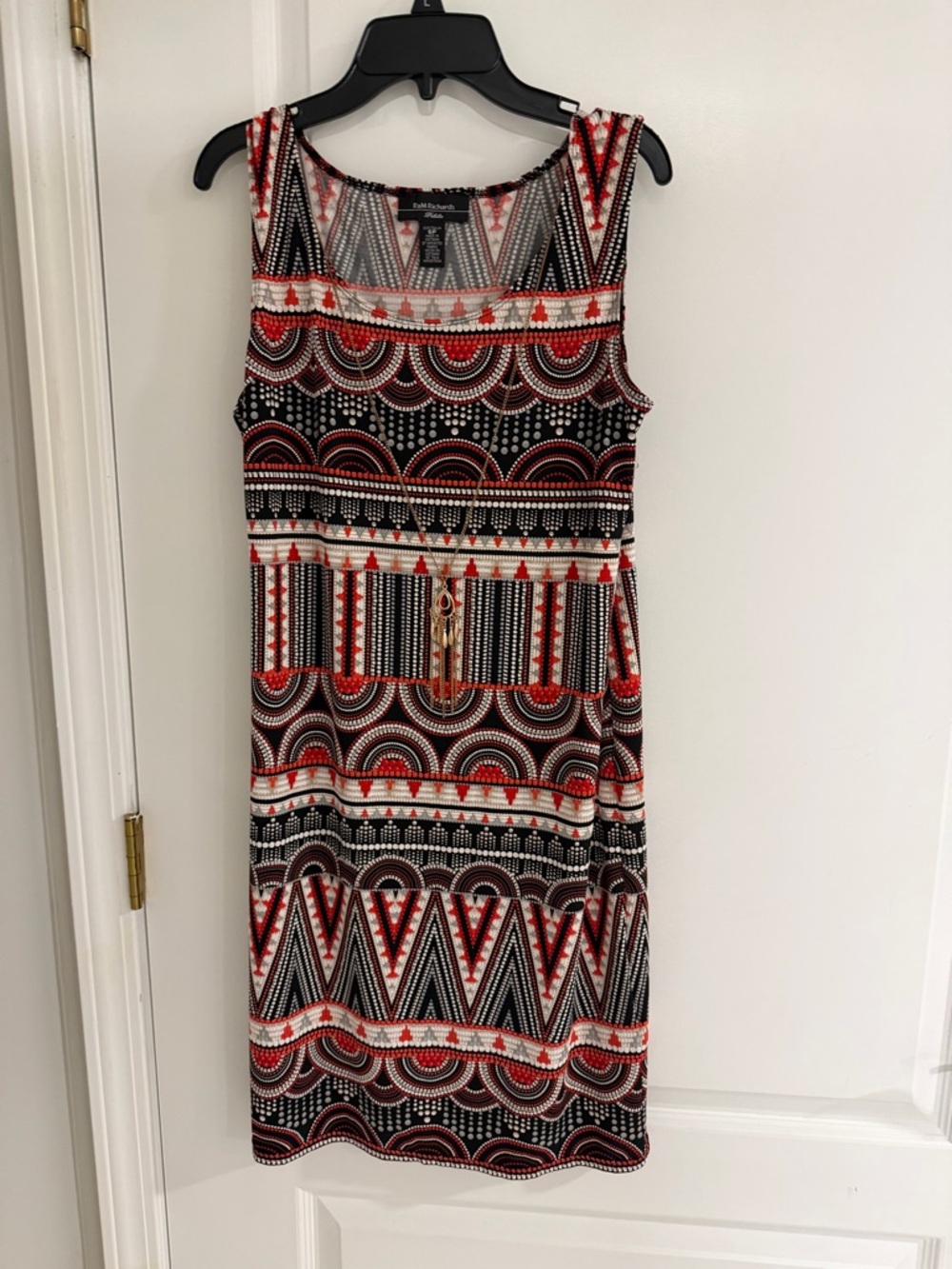 Scoop neck red, black, and white knee length dress with gold removable necklace